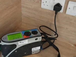 electrical tester plugged into socket outlet