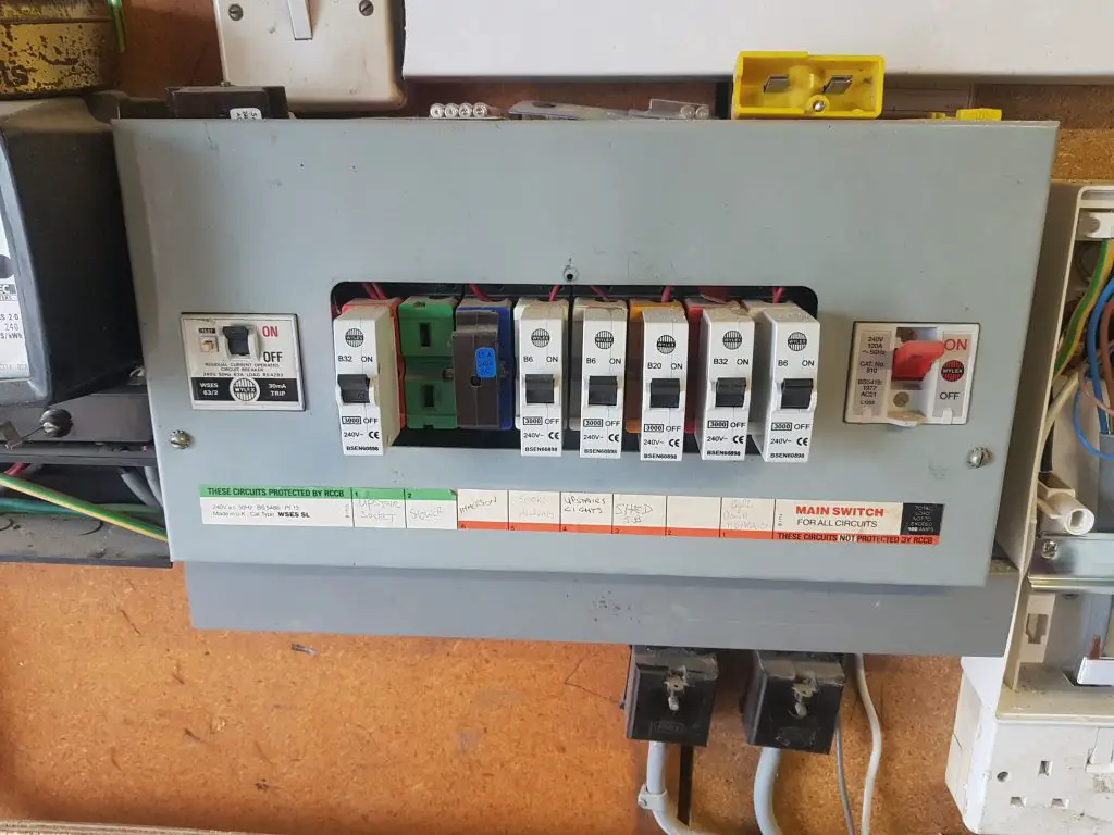 old metal fusebox in need of upgrade, found during private landlord electrical safety inspection.
