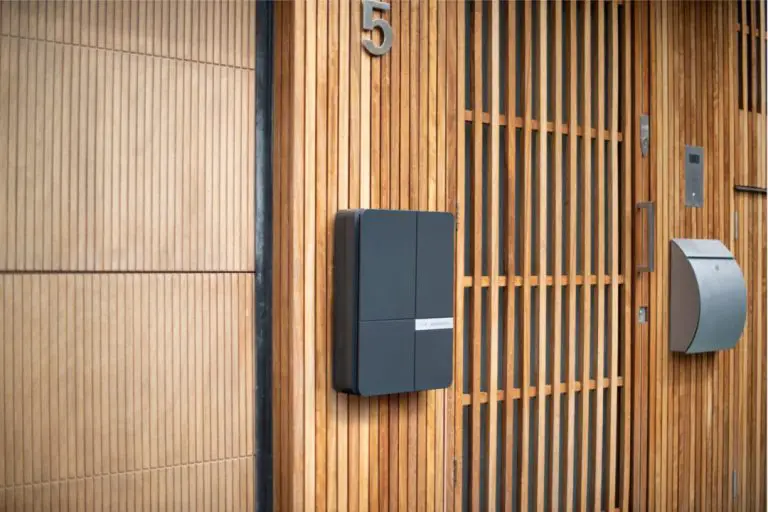 Blue ev charger on wood cladding