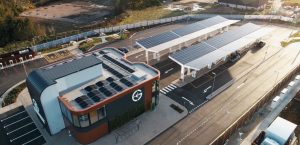 aerial view overlooking Gridserve electric forecourt, including solar PV canopies