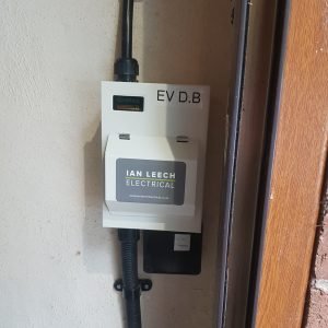 2-way electrical consumer unit installed on garage wall for EV charge point