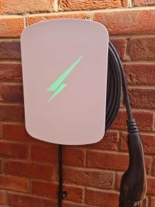 White Hypervolt EV charger installed on brick wall